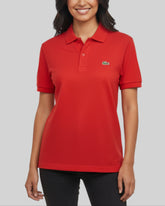 Polo Lacoste rouge – taille L – seconde main femme